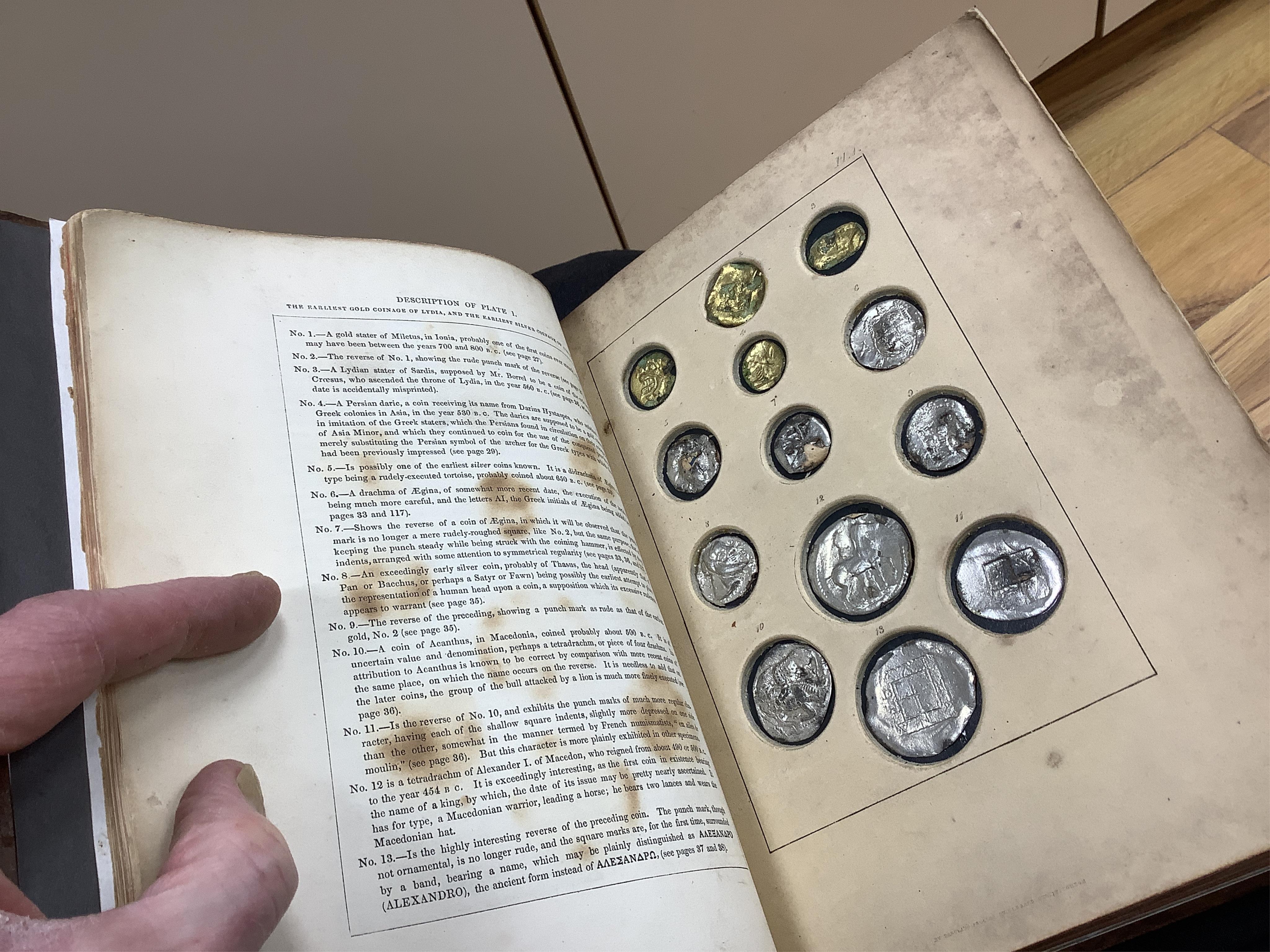 Humphreys, Henry Noel. Ancient Coins and Medals. London: Grant and Griffith, 1850. Octavo, original elaborately embossed full brown calf, marbled endpapers with 114 relief facsimiles of coins and medals on ten thick moun